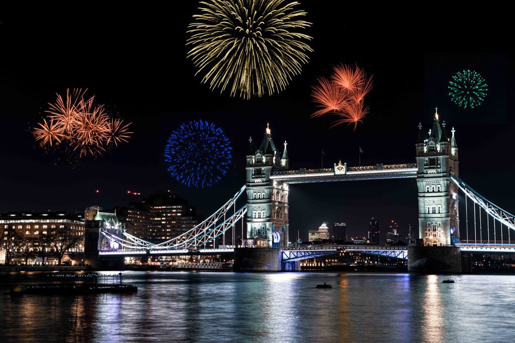 Londons Tower Bridge on the river Thames at night with fireworks