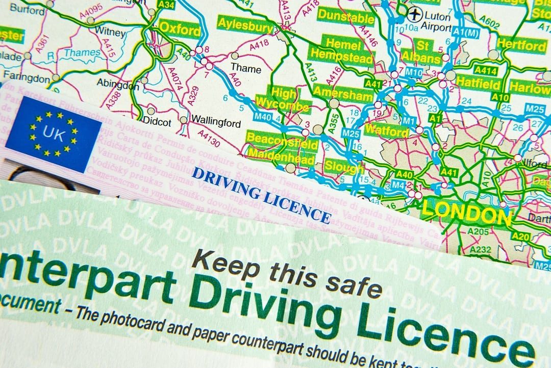 A paper and card driving license
