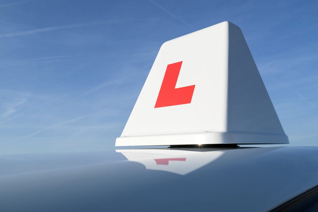 learner sign on top of vehicle