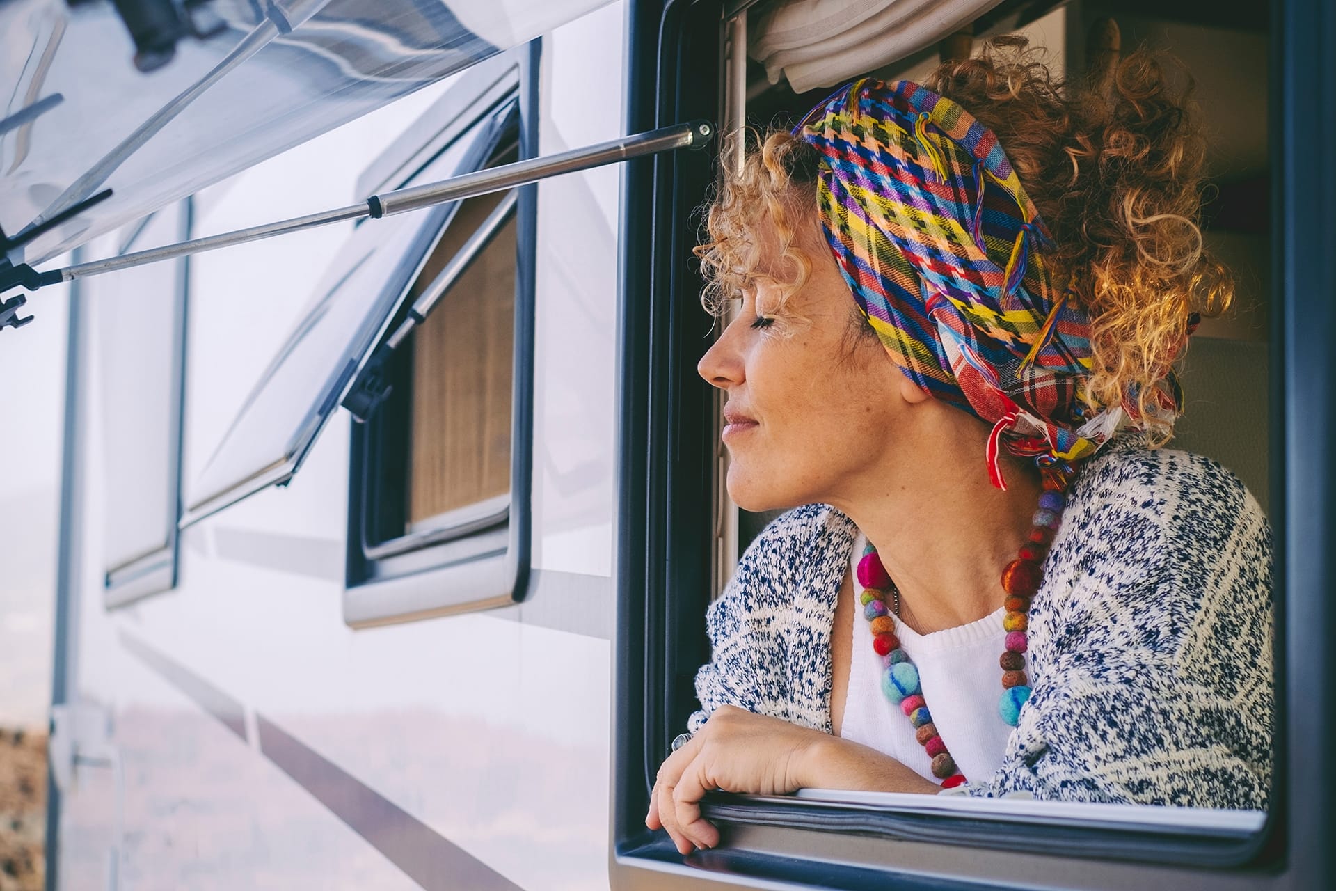 Woman looking out of motorhome window
