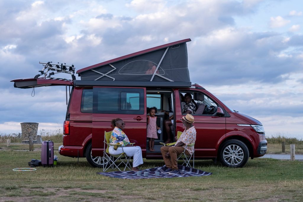 family sat outside motorhome