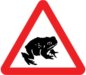 Migratory toads crossing road sign