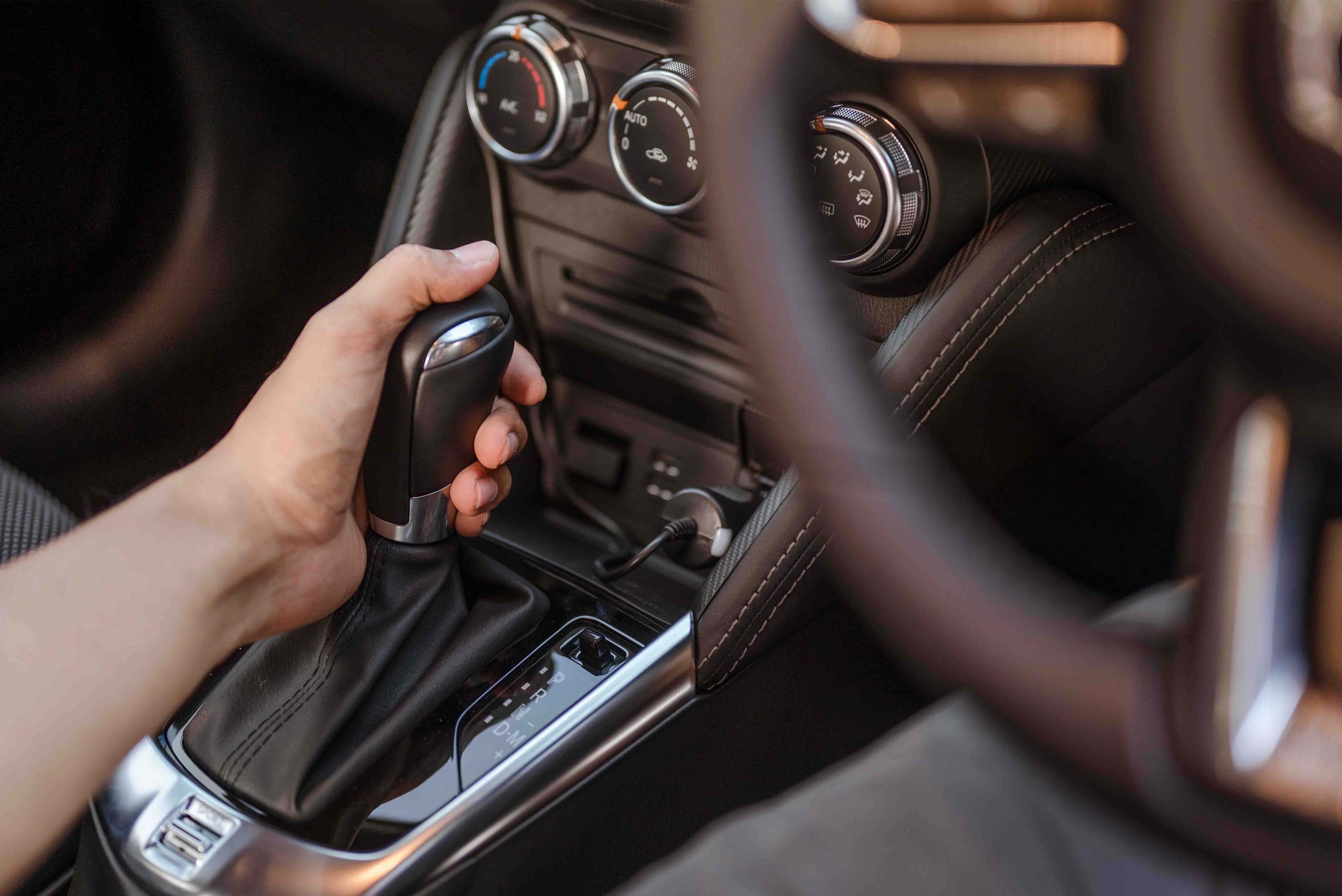 Person holding the gear selector