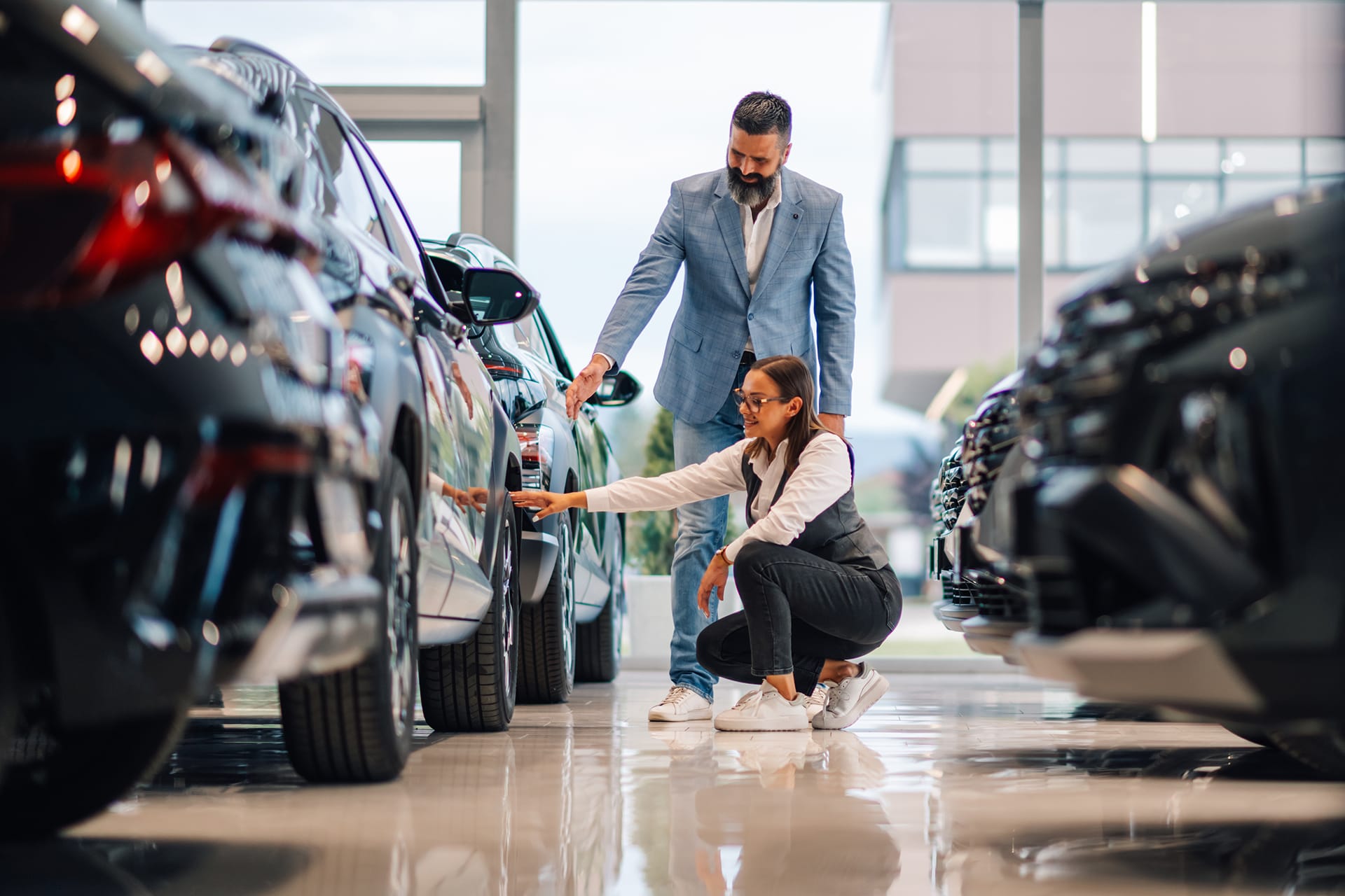 woman checking a new car